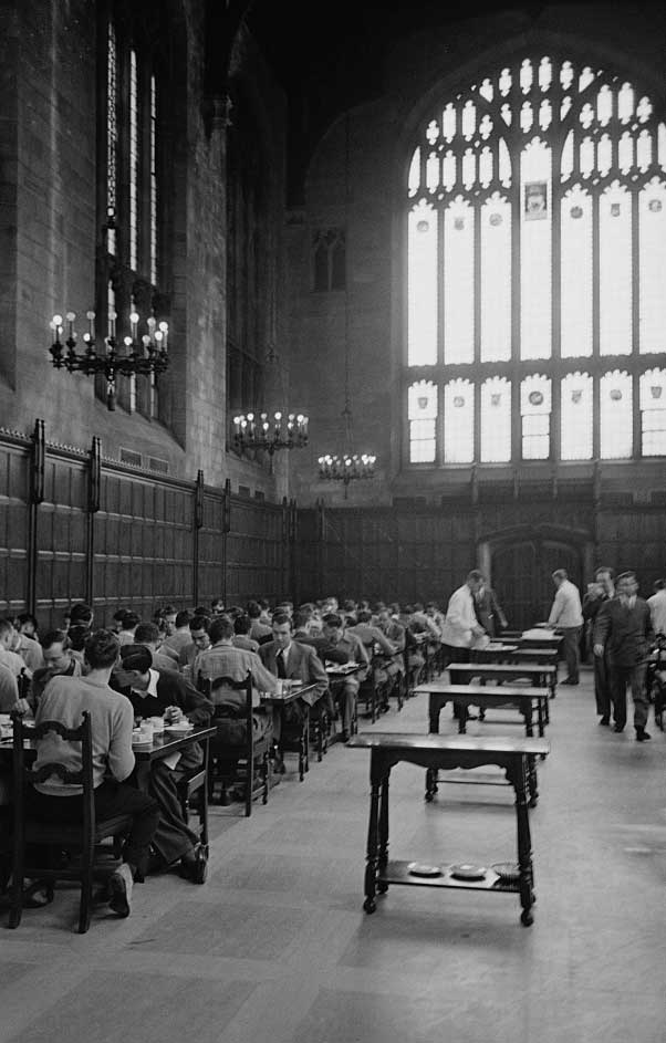 Black and white photo of gothic dining room at the U-M Law School in Ann Arbor, Michigan. All male diners. 1949. (Image credit: Stanley Kubrick, Look magazine photograph collection, Library of Congress.)