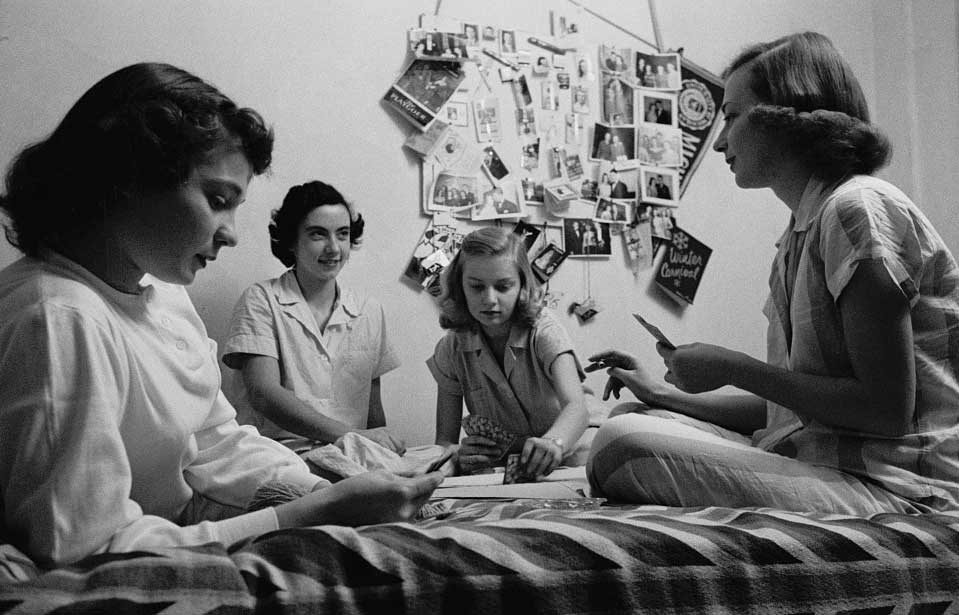 Four University of MIchigan female students, circa 1949, sit on a bed, playing cards. (Image credit: Stanley Kubrick, Look magazine photograph collection, Library of Congress.)
