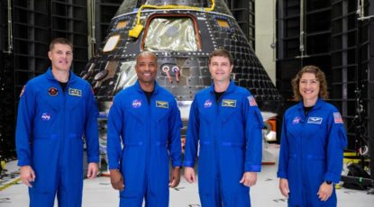 The Artemis II crew stand in front of the Orion spacecraft that will take them around the moon. The crew are (from left to right): Jeremy Hansen, mission specialist; Victor Glover, pilot; Reid Wiseman, commander; and Christina Hammock Koch, mission specialist. NASA will monitor University of Michigan Engineering’s solar particle forecasts during the mission to maintain situational awareness of impending harmful radiation released during solar flares and eruptions, which could create conditions in which astronauts take safety precautions. Image credit: Kim Shiflett, NASA.