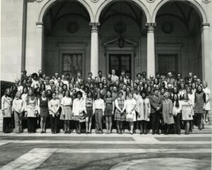 Black and white image of the Library Science Class of 1972 standing in front of a University of Michigan building in Ann Arbor. Mostly women. (Image courtesy of U-M's Bentley Historical Library.)