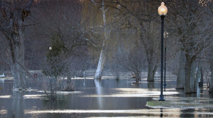 The river flooded the sidewalk and trees on Island Park - Grand Ledge, Michigan, March 2026