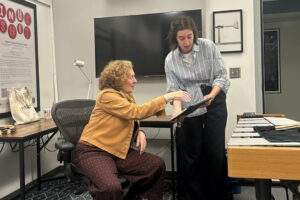Composer and mentor Julia Wolfe collaborates with a percussion student in a room with musical instruments at the University of Michigan.