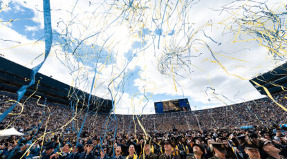 Students celebrate at the conclusion of the 2026 Spring Commencement ceremony. (Photo by Connor Titsworth, Michigan Commons.)