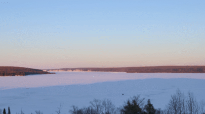 View of a huge lake covered in ice.