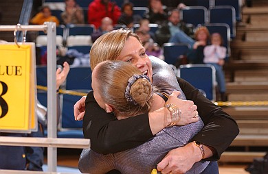 'Every good program is bigger than any one season,' says women's gymnastics coach Bev Plocki.  'Sticking by your principles might cost you in the short run, but you'll be better off in the long run.' (Photo: Martin Vloet, U-M Photo Services.) <a href=