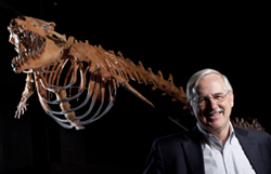 Philip Gingerich standing in front of ancient whale skeleton