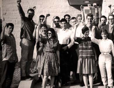 Tom Hayden (far left) and members of the SDS at a national council meeting. (Photo by C. Clark Kissinger.)