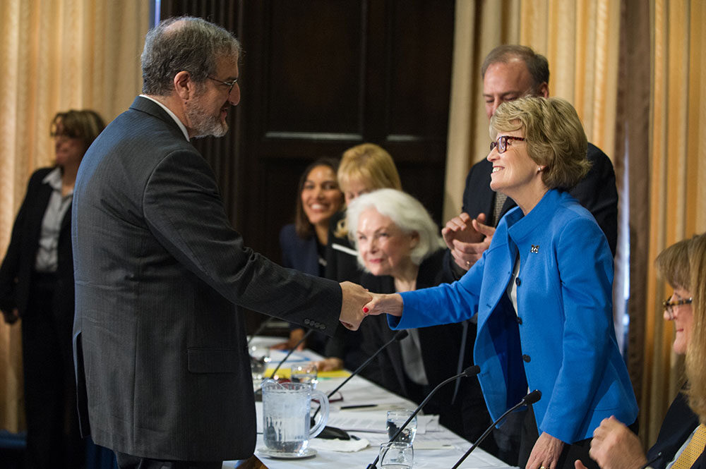 Shlissel and Coleman shake hands