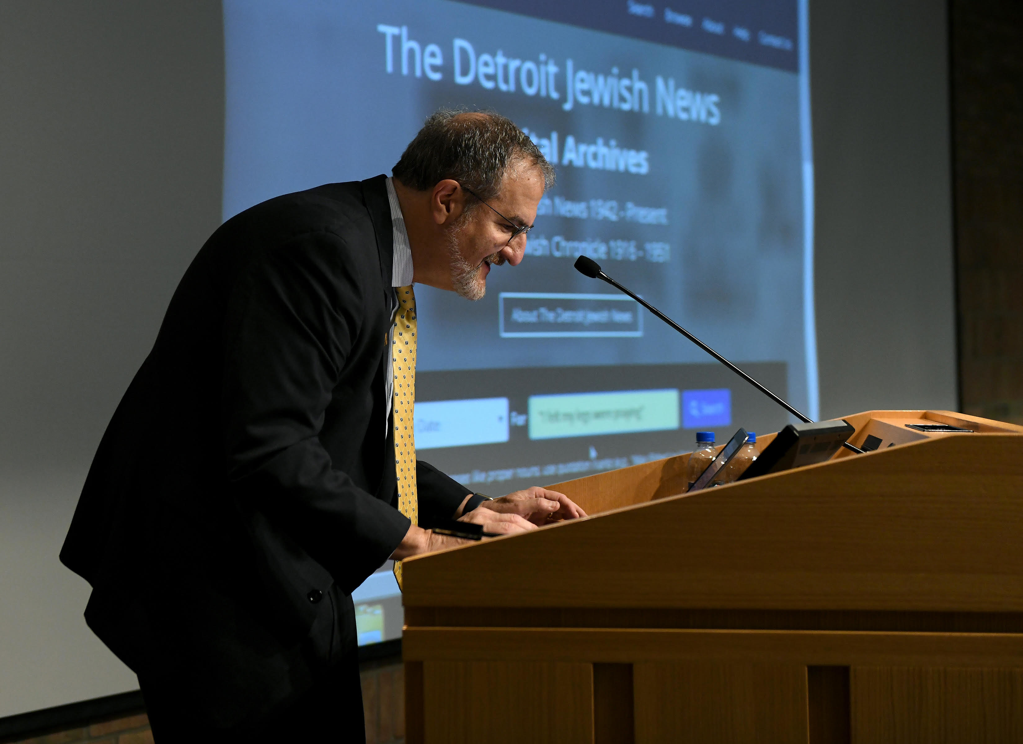 U-M President Mark S. Schlissel conducts the first official search of the new Detroit Jewish News digital archive with the quote, “I felt my legs were praying” on Nov. 5, 2018. (Image: Lon Horwedel.)