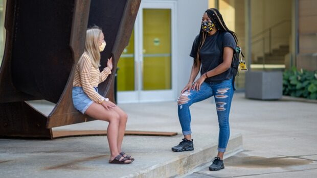 students wear masks on campus