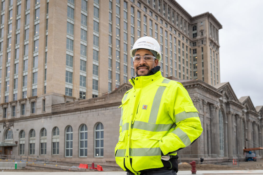 Alumnus Manuel Martinez at the Michigan Central Station renovation project in Detroit. He is dressed in construction gear.