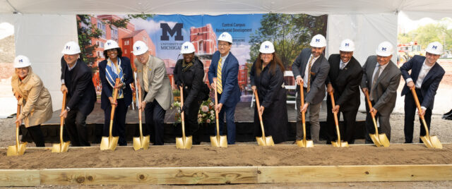 University leaders in hard hats with shovels at a groundbreaking ceremony. Fall 2023.