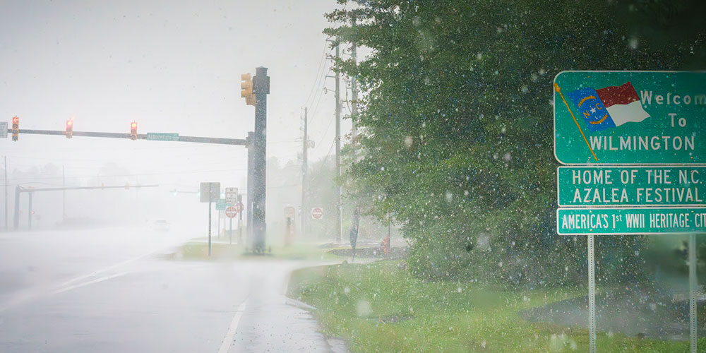 An image of a road in Wilmington, NC, under heavy rains.