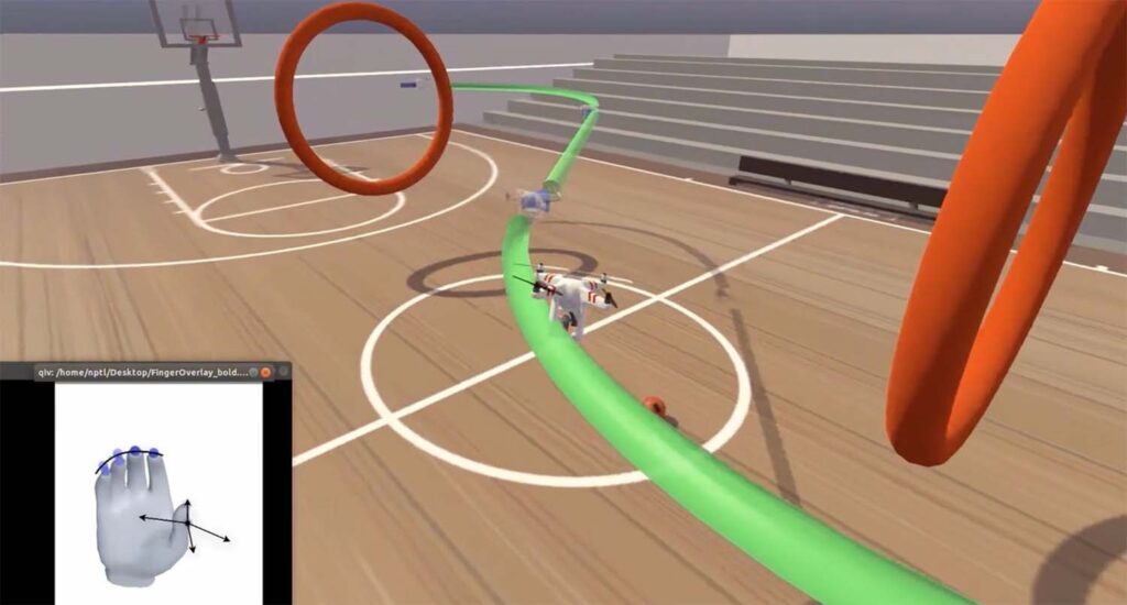 A screenshot of the game display shows the quadcopter following a green path around the rings. The inset shows a hand avatar. The neural implant records from nearby neurons and algorithms determine the intended movements for the hand avatar. The finger positions are then used to control the virtual quadcopter. (Image credit: Nature Medicine.)