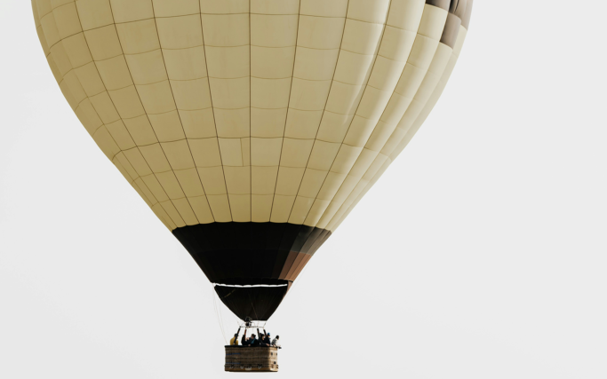 Hot air balloon sails through the sky.