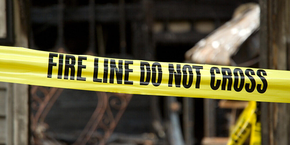 Yellow tape reads: Fire Line Do Not Cross