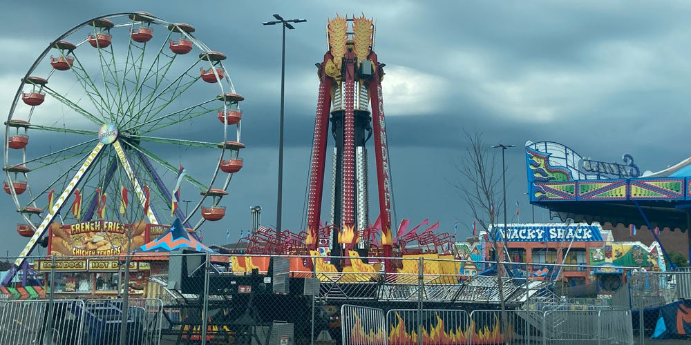 Image of a carnival under a stormy sky at Iggy Pop's high school, Pioneer, in Ann Arbor, Michigan