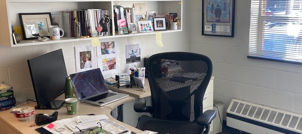 Desk setting amid cincerblock walls.